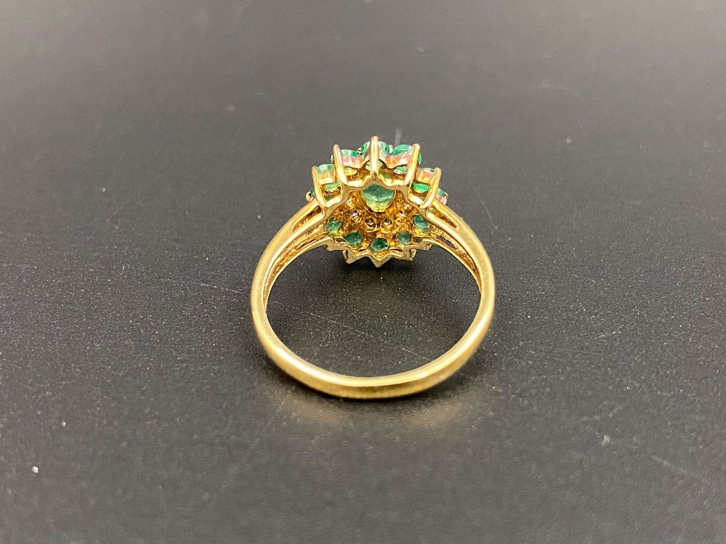 <p>An Emerald & Diamond 9ct gold cluster ring</p>
