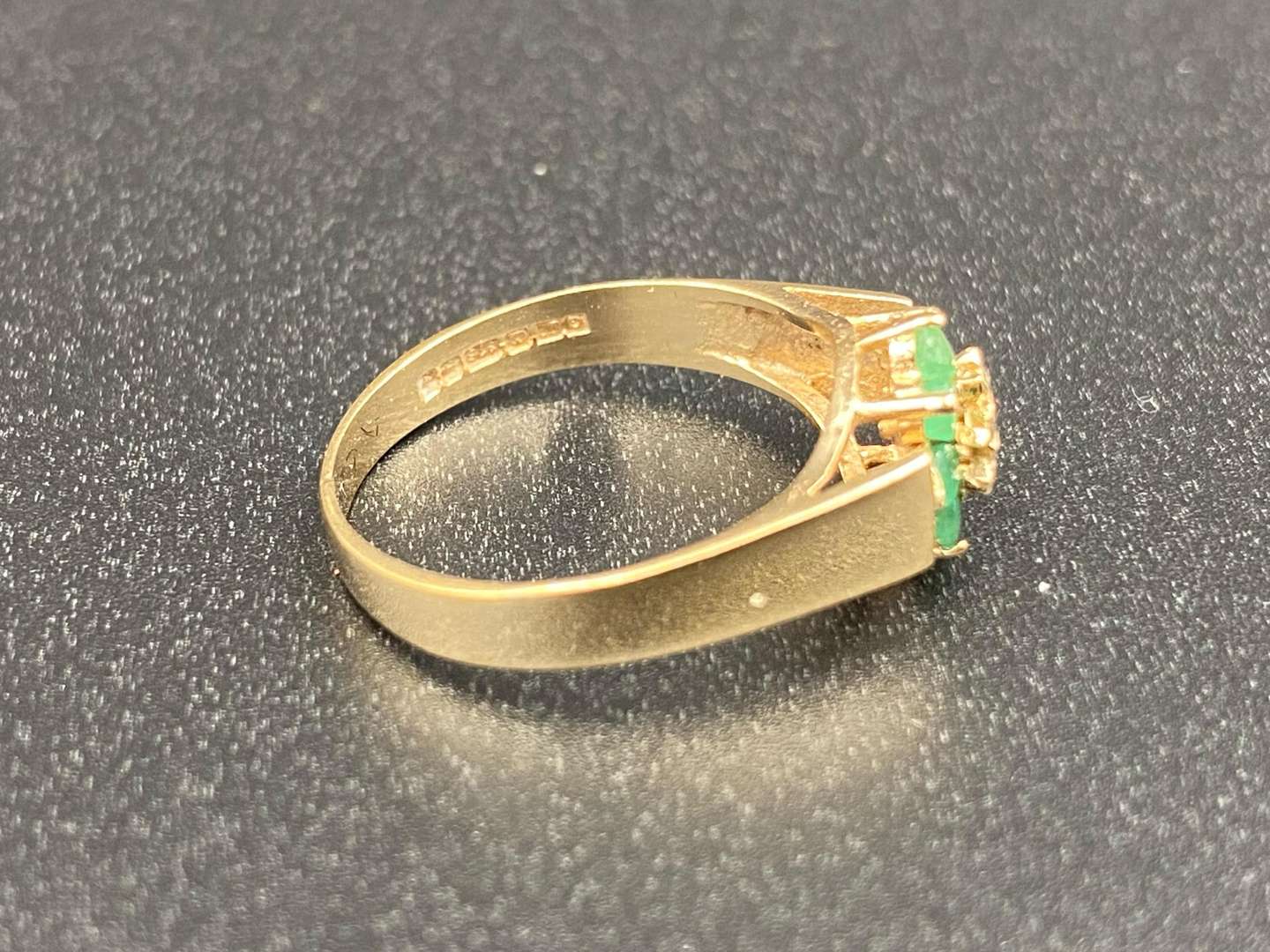 <p>An Emerald and Diamond flower head, 9ct gold ring,</p>