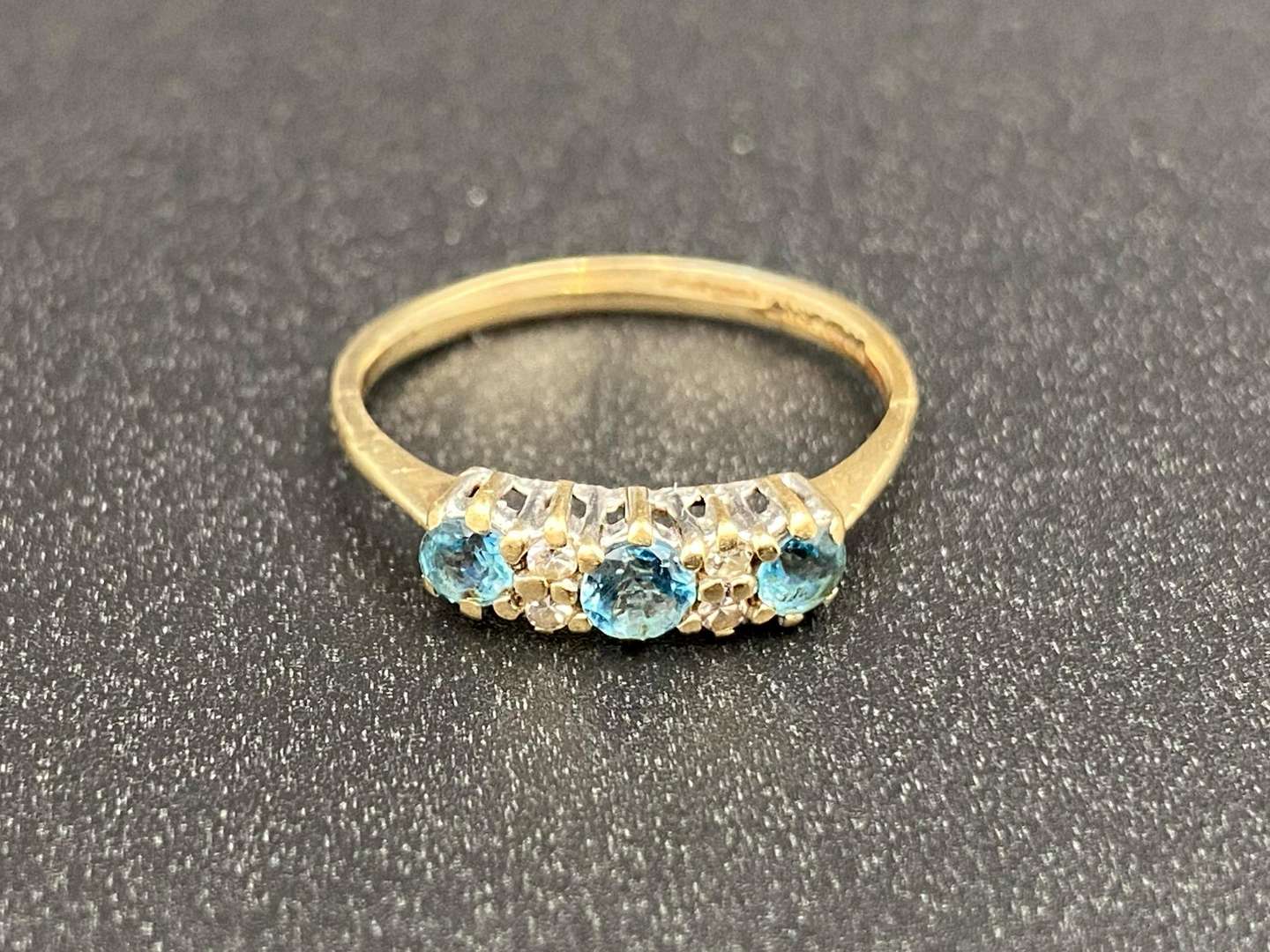 <p>A Topaz and Diamond set, three stone, 9ct gold ring</p>