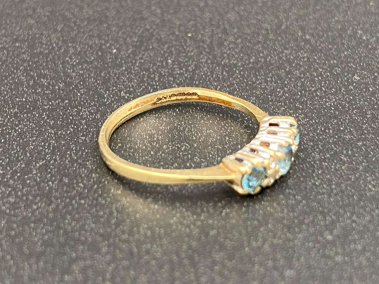 <p>A Topaz and Diamond set, three stone, 9ct gold ring</p>
