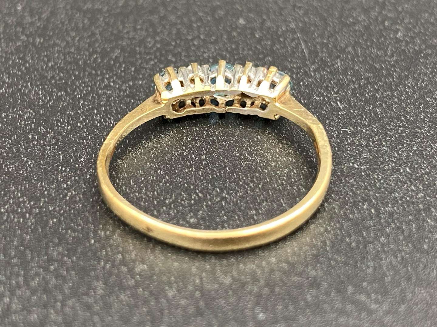 <p>A Topaz and Diamond set, three stone, 9ct gold ring</p>