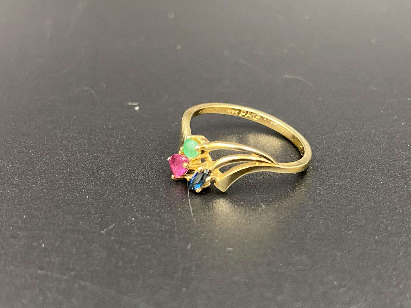 <p>An Emerald Ruby & Sapphire 9ct gold ring</p>