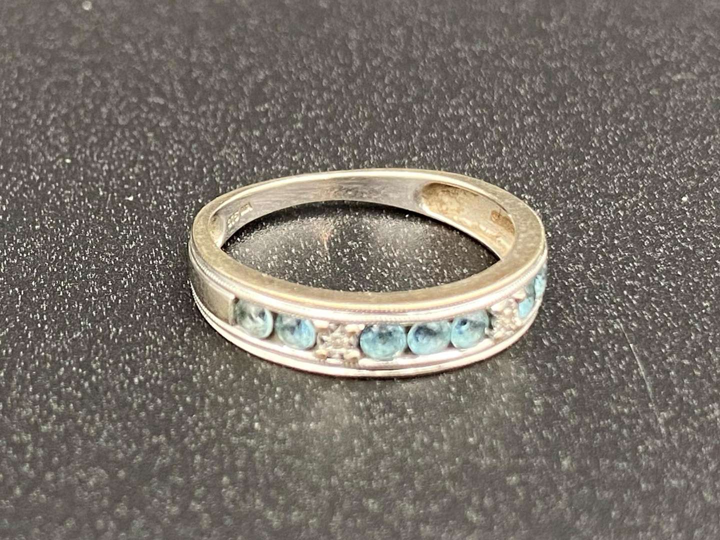 <p>A Topaz and Diamond set ½ Eternity ring</p>