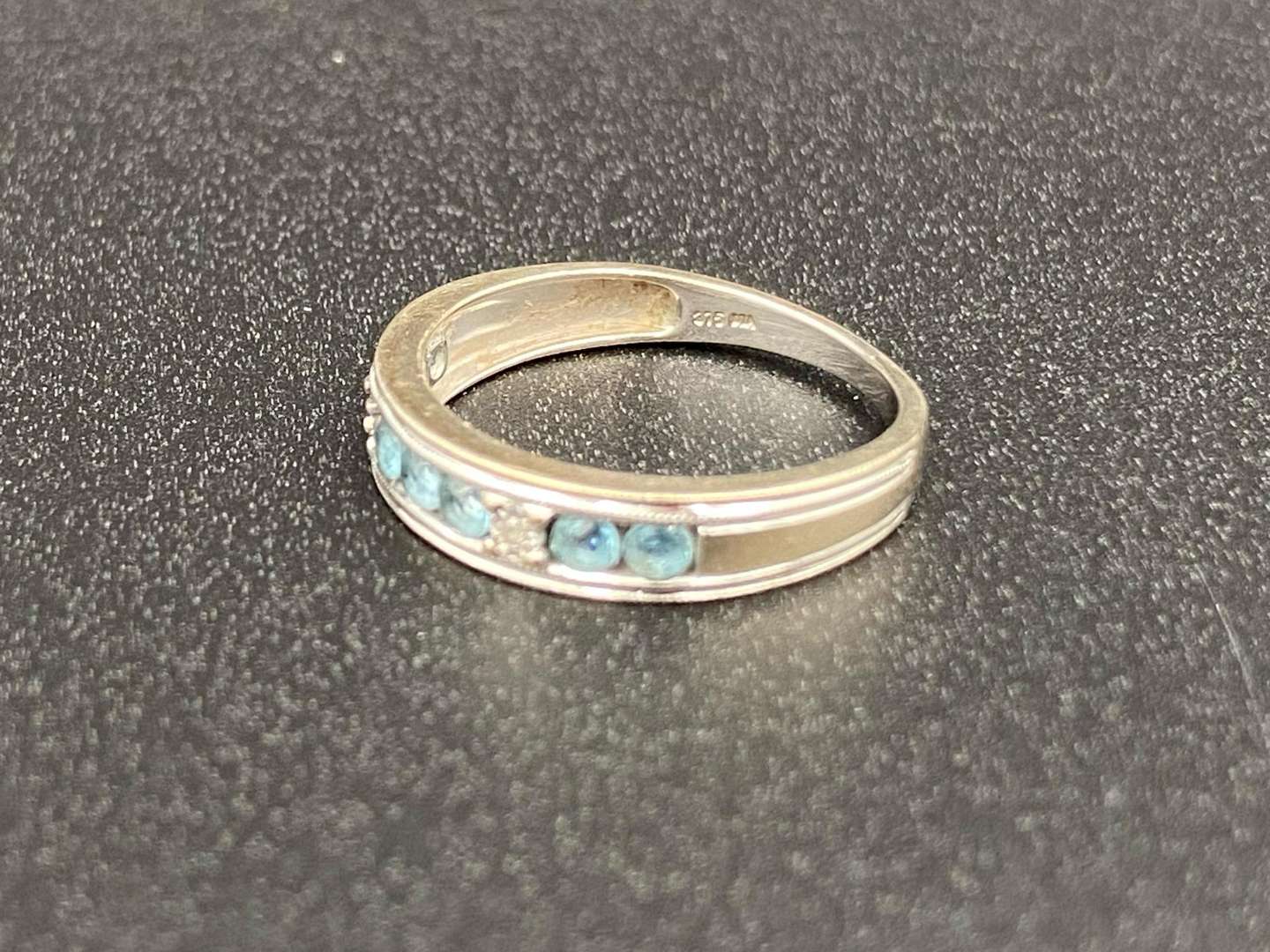 <p>A Topaz and Diamond set ½ Eternity ring</p>