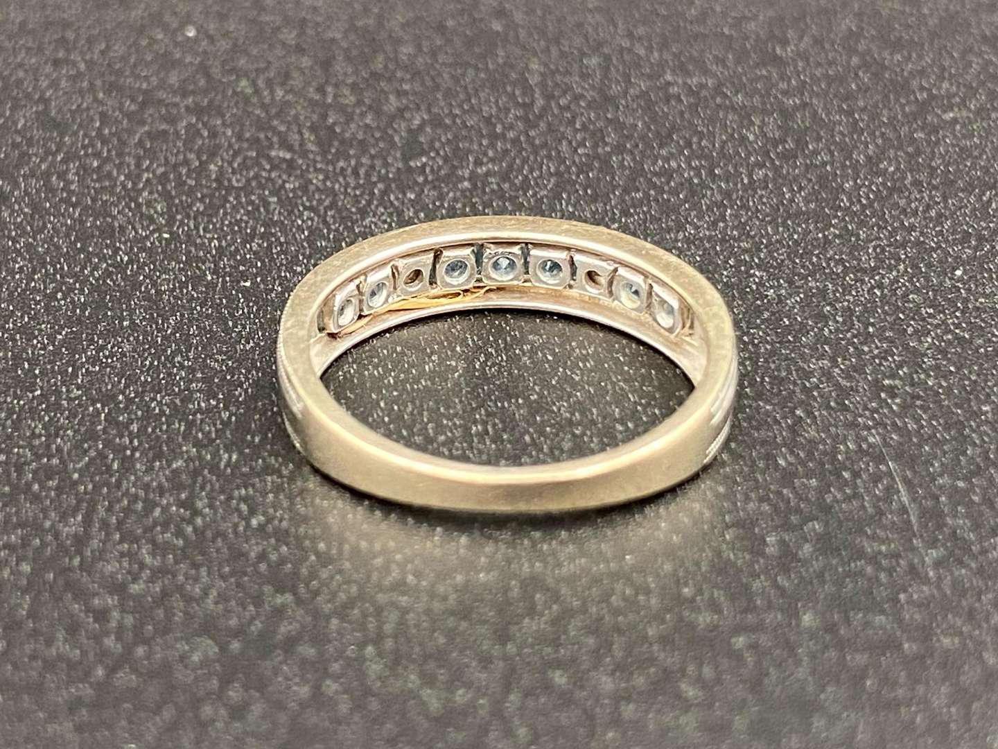 <p>A Topaz and Diamond set ½ Eternity ring</p>