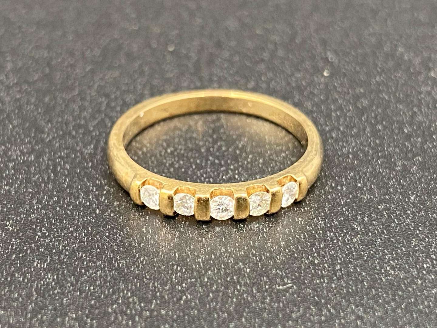 <p>A diamond set, five stone, 9ct gold ring,</p>