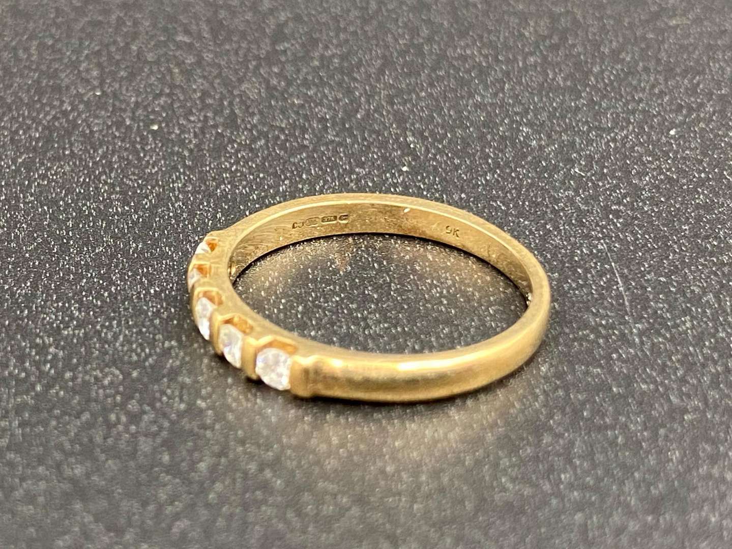 <p>A diamond set, five stone, 9ct gold ring,</p>