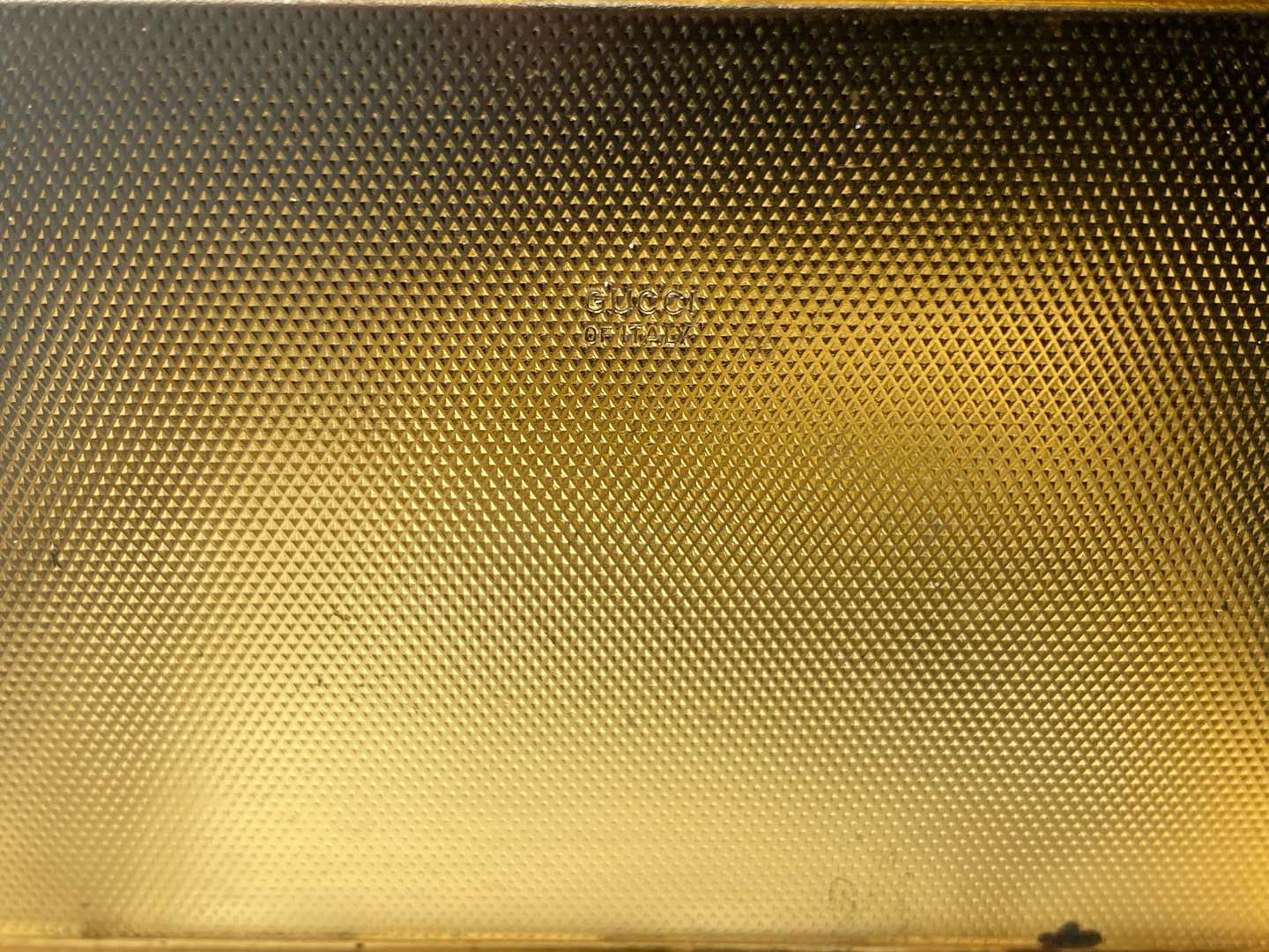 <p>GUCCI, enameled, rectangular gilt metal card/ cigarette case,</p>