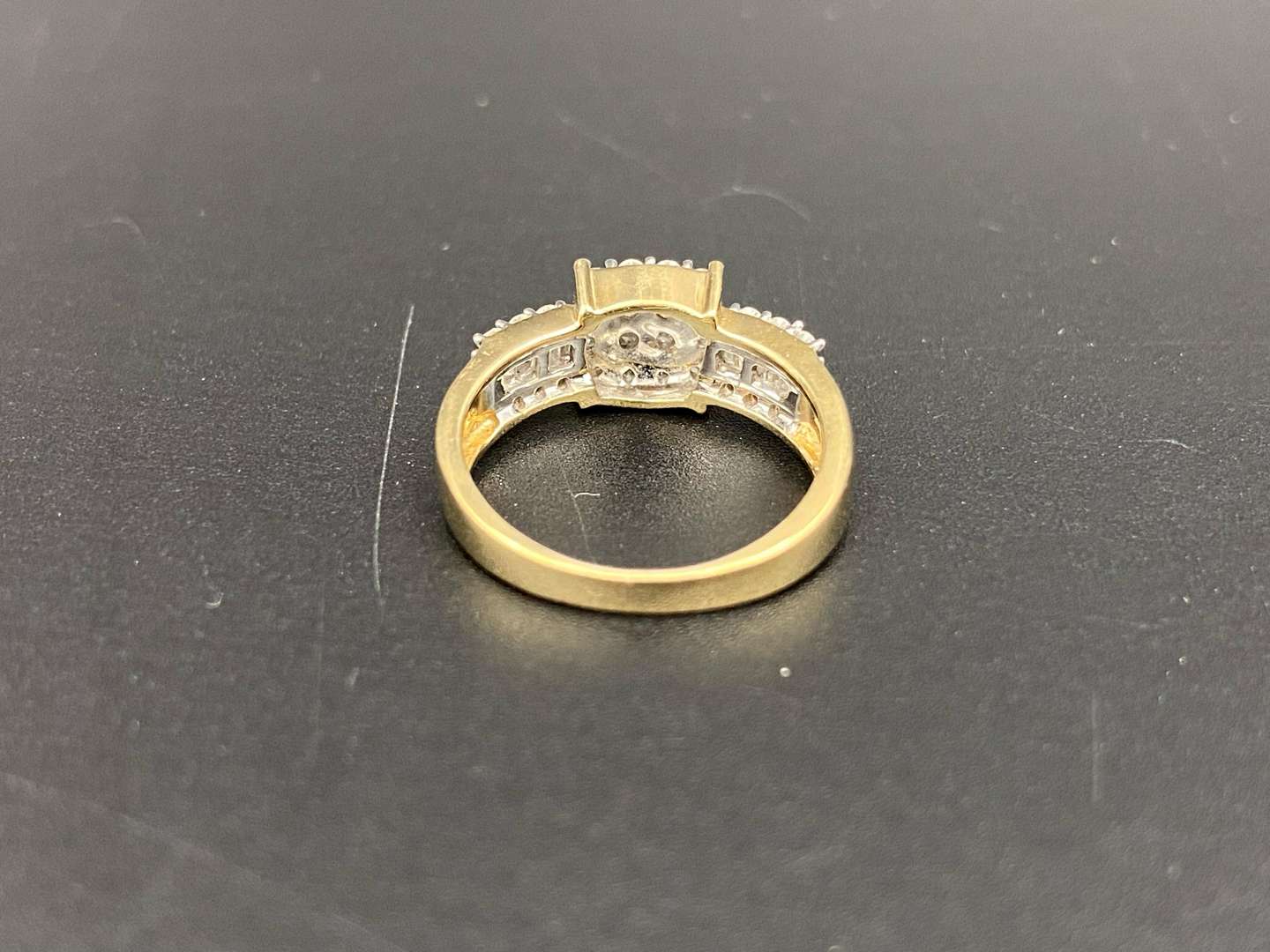 <p>&nbsp;A diamond set, 9ct gold cluster ring,</p>