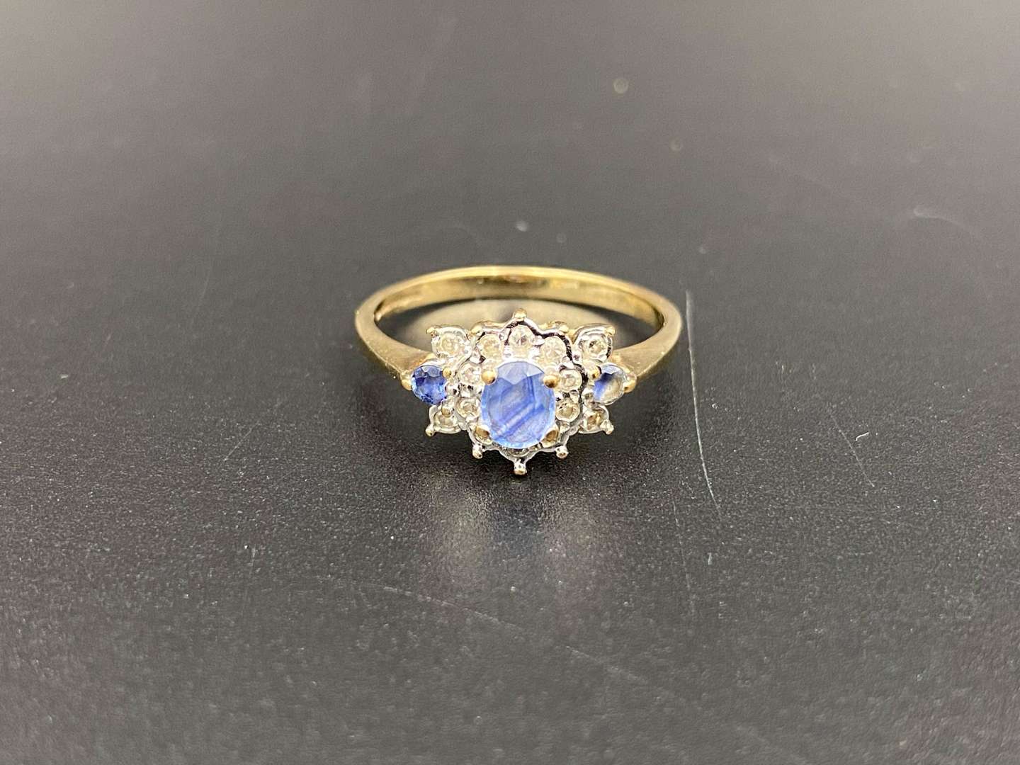 <p>A Saphire and Diamond set, 9ct gold cluster ring,</p>