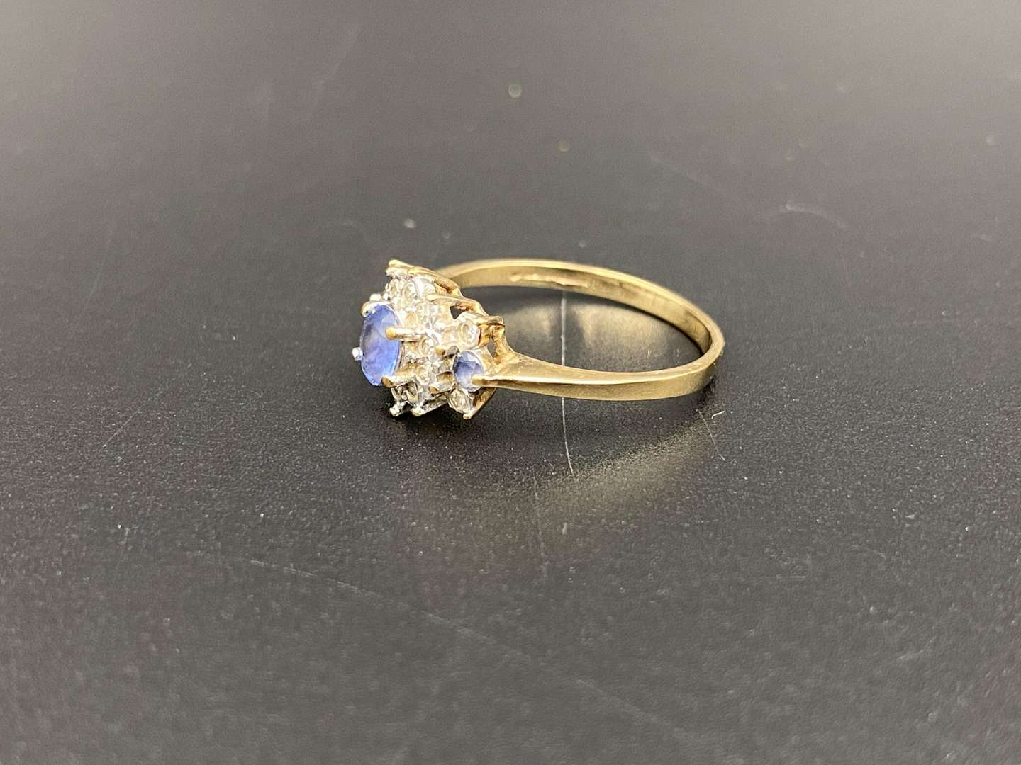 <p>A Saphire and Diamond set, 9ct gold cluster ring,</p>