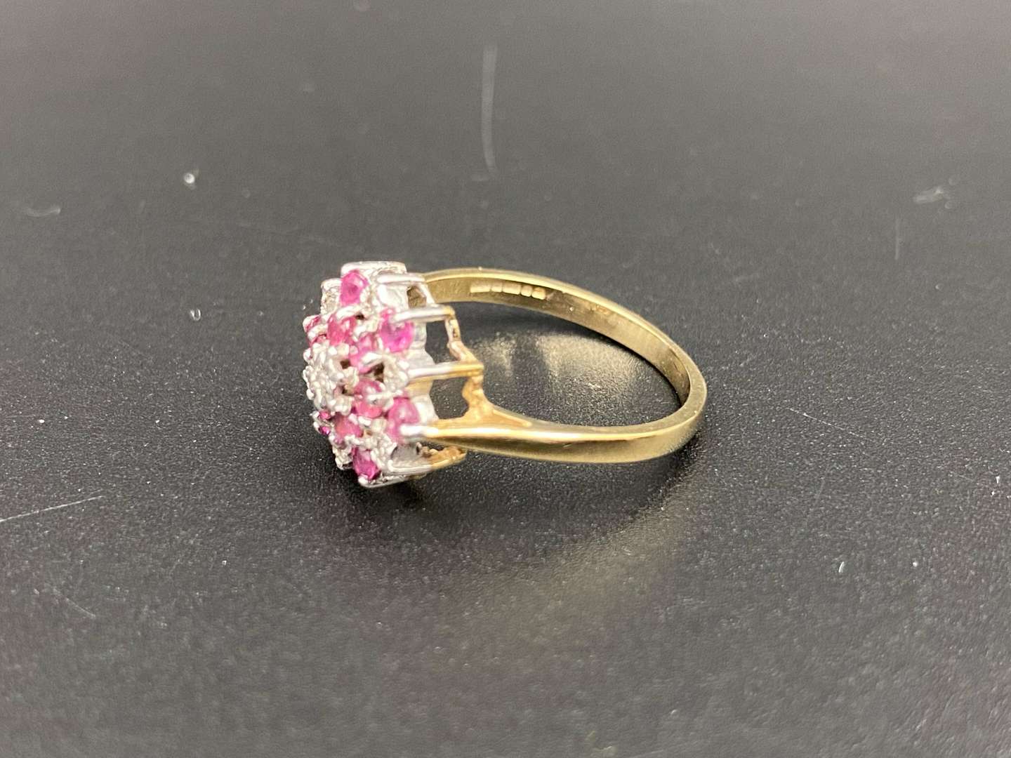 <p>A Ruby and Diamond set flower head, 9ct gold ring</p>