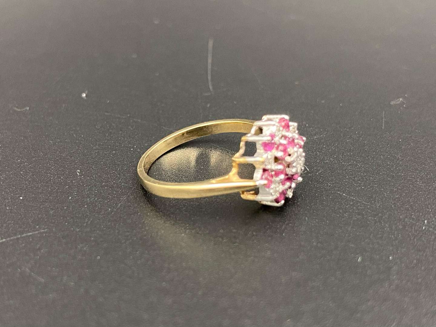 <p>A Ruby and Diamond set flower head, 9ct gold ring</p>