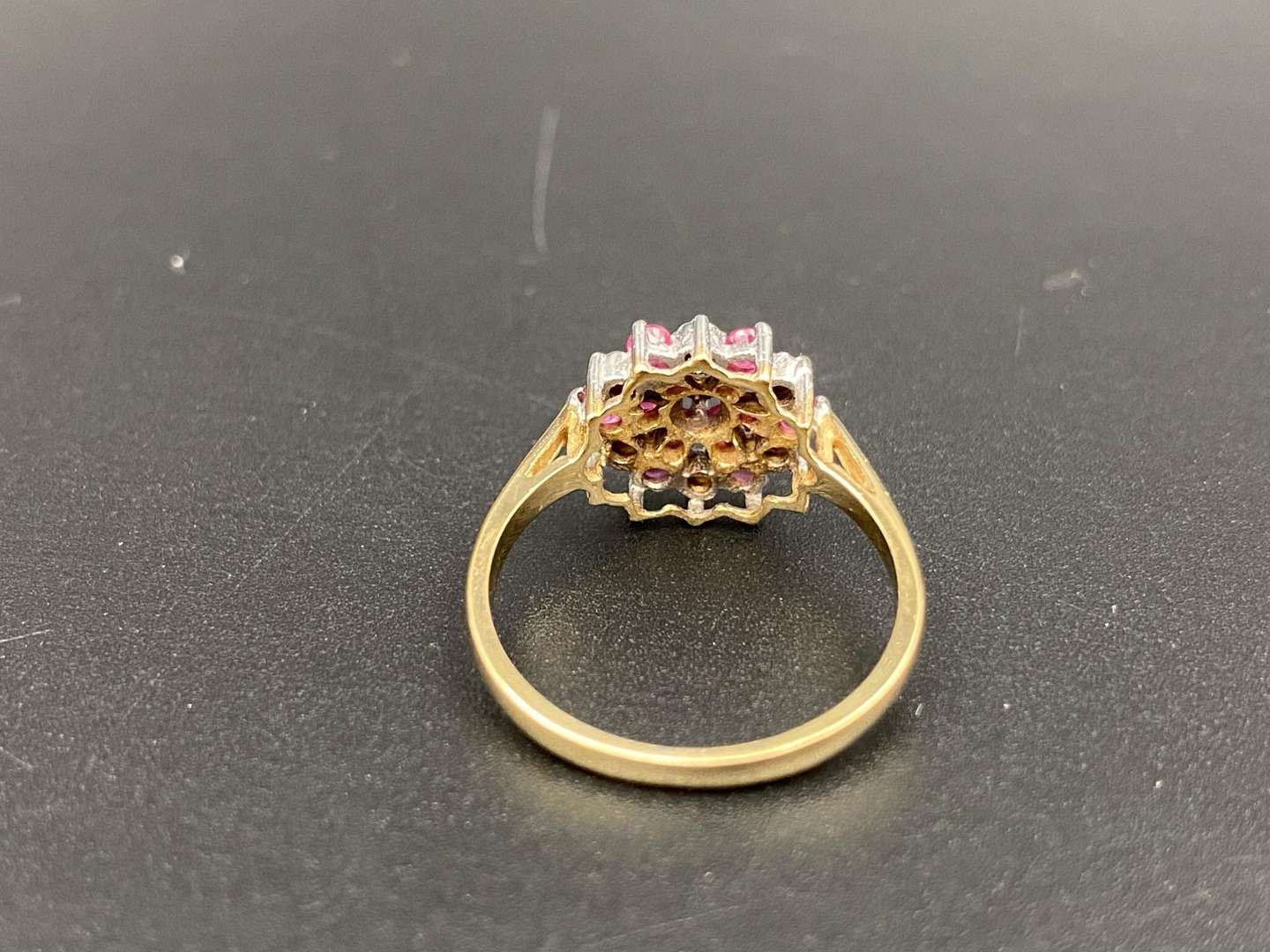 <p>A Ruby and Diamond set flower head, 9ct gold ring</p>