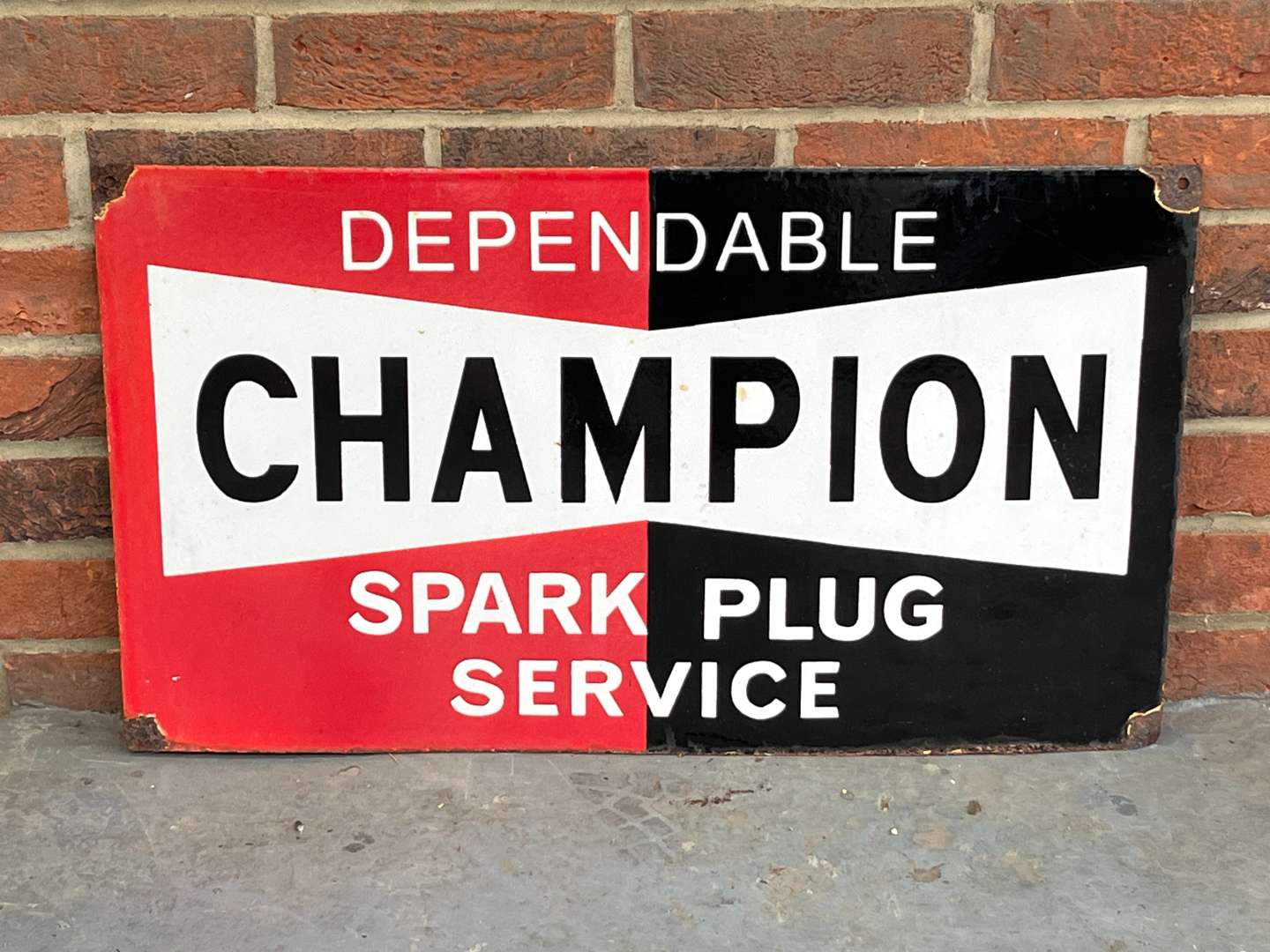 <p>Dependable Champion Spark Plugs Enamel Sign</p>