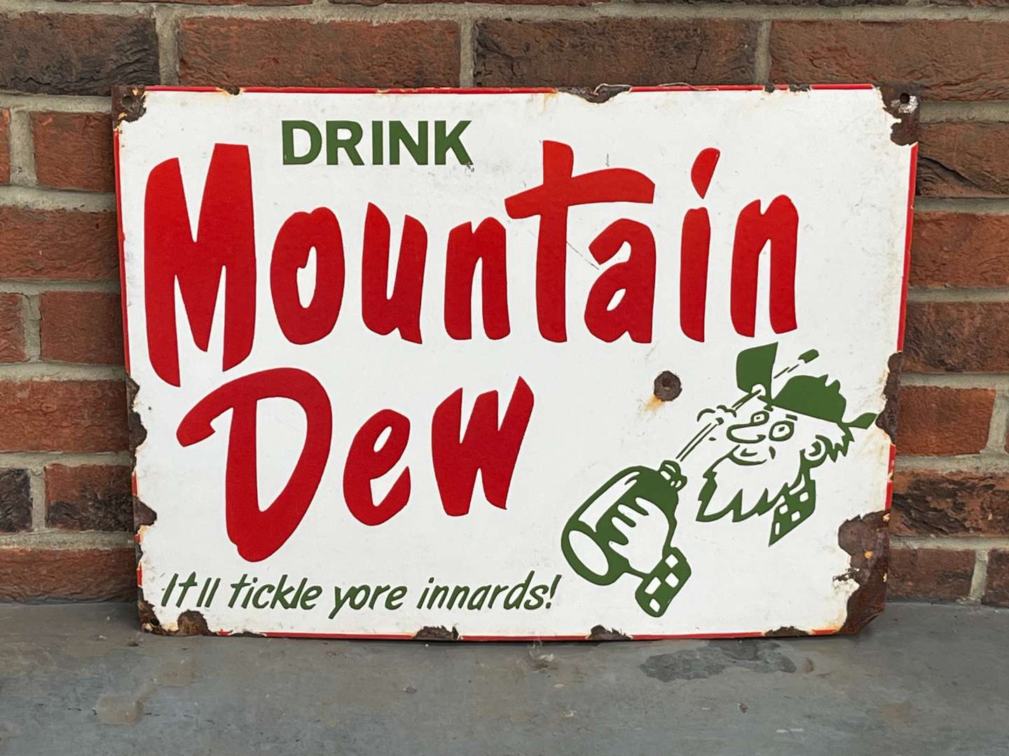 <p>Drink Mountain Dew Enamel Sign</p>