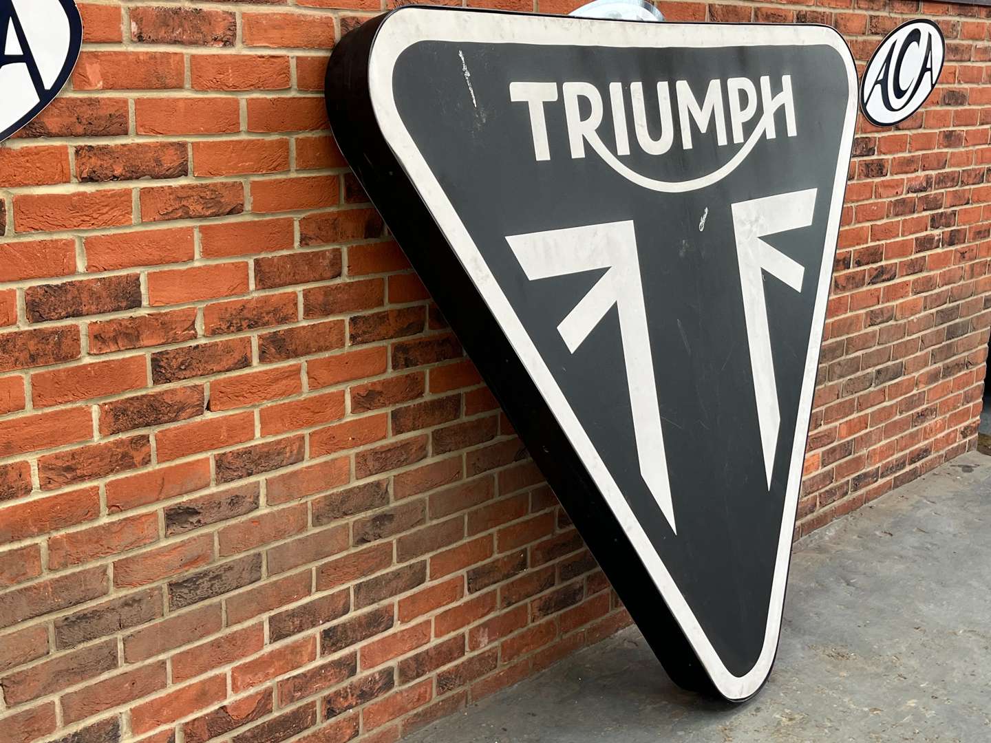 <p>Extremely Large Triumph Triangular Dealership Illuminated Sign</p>