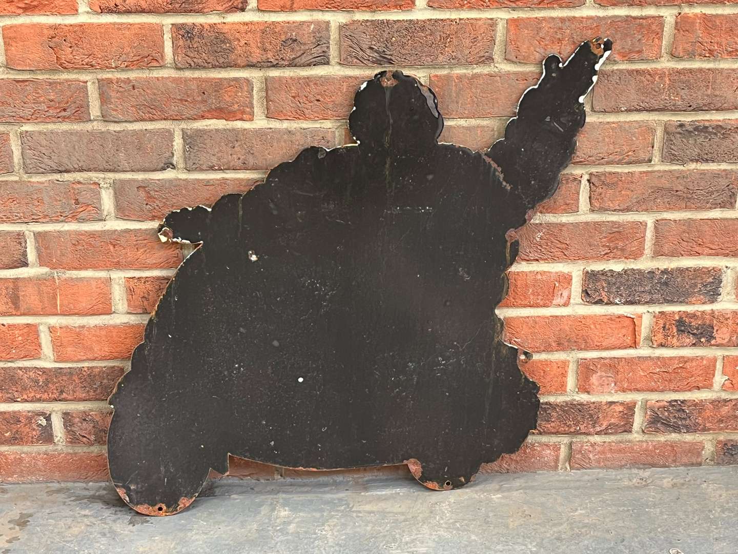 <p>Michelin Man On a Scooter Enamel Sign</p>