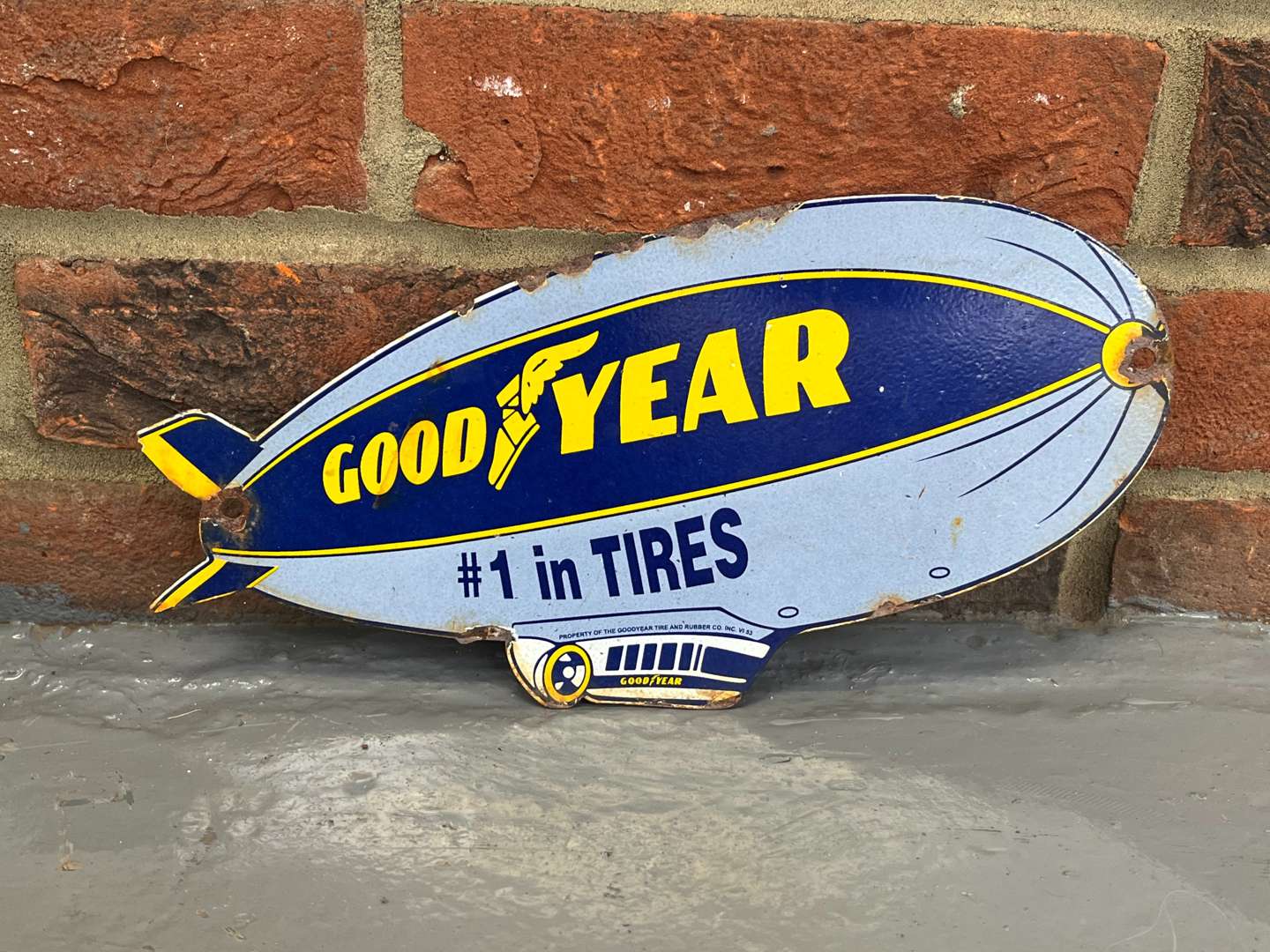 <p>Goodyear Blimp Tires Small Enamel Sign</p>
