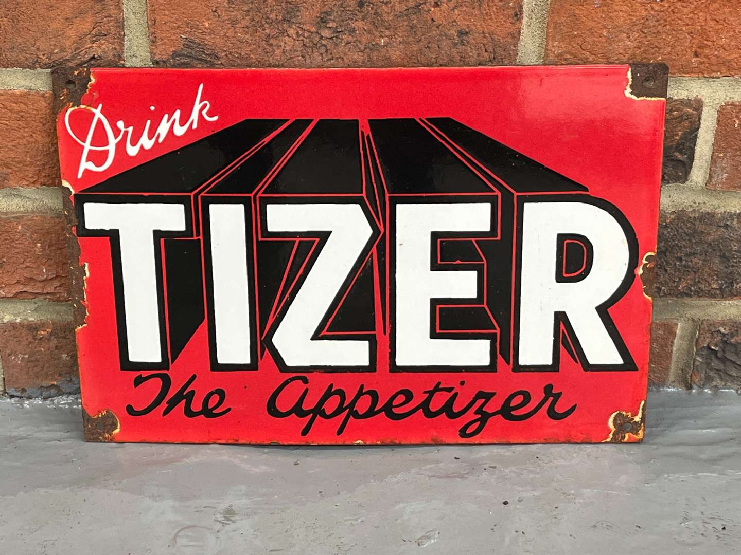 <p>Drink Tizer Enamel Sign</p>