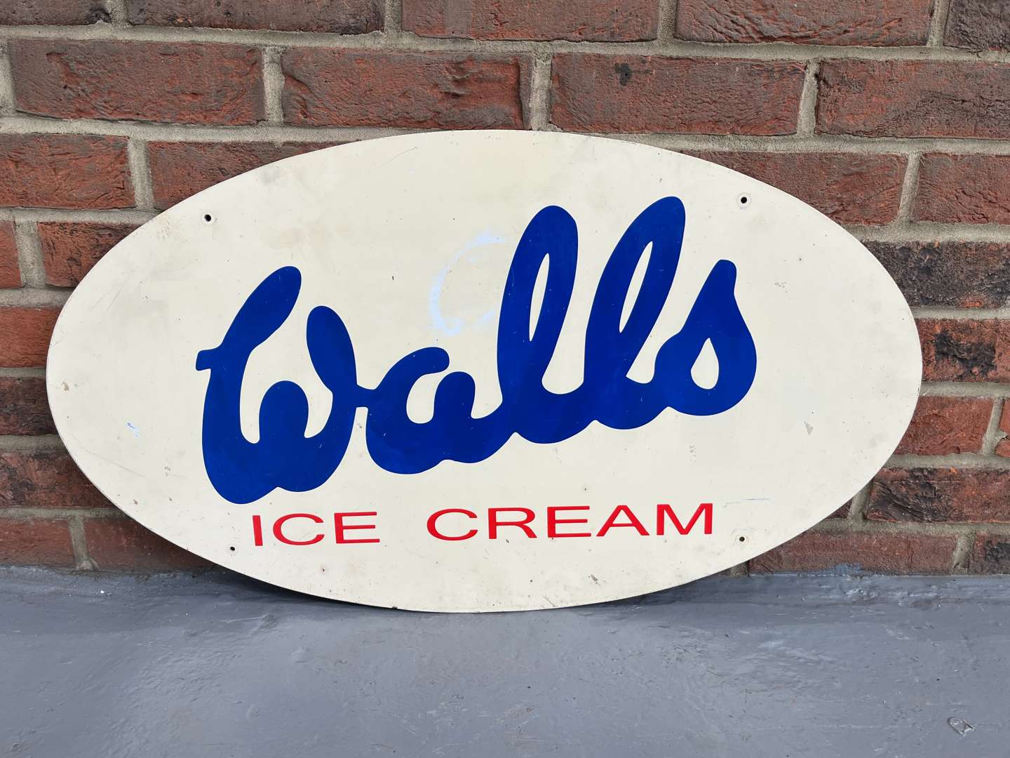 <p>Walls Ice Cream Oval Sign</p>