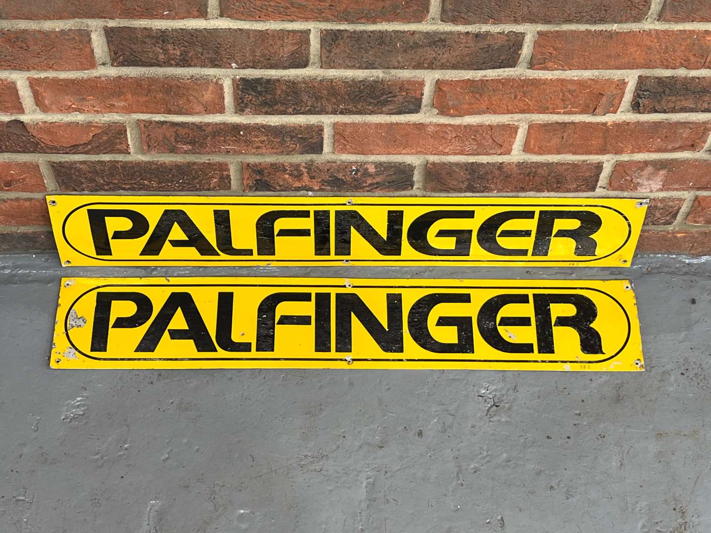 <p>Two Palfinger Metal Signs</p>