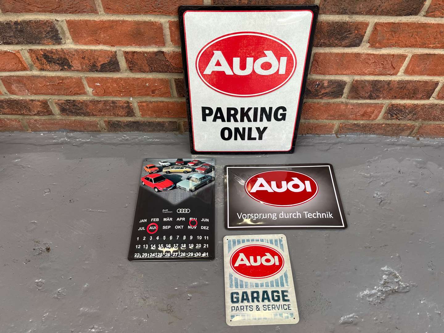 <p>Four Metal Audi Advertising Signs&nbsp;</p>