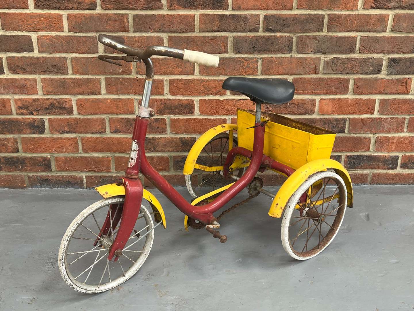 <p>Red and Yellow Tin Plate Childs Trike</p>