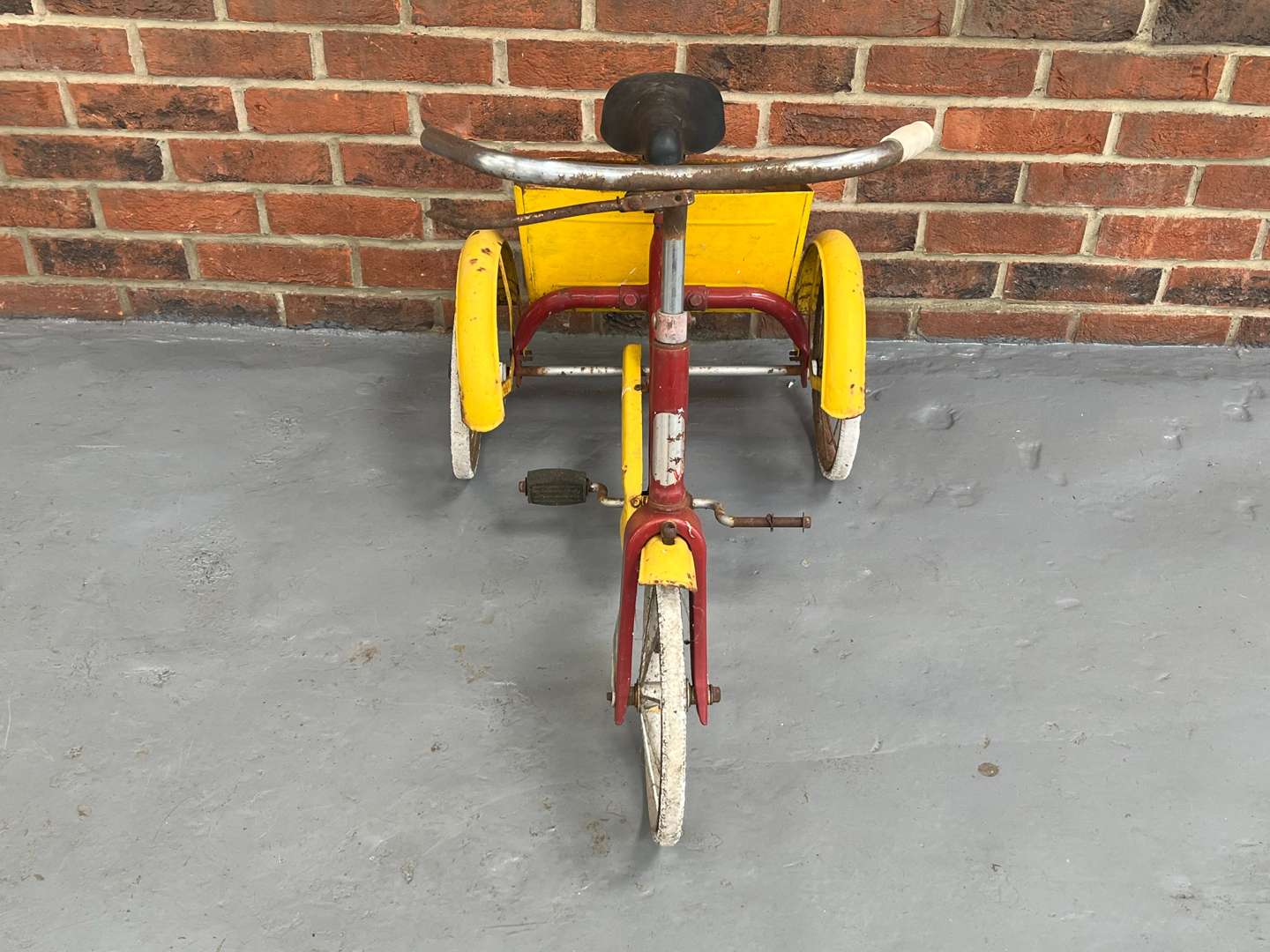 <p>Red and Yellow Tin Plate Childs Trike</p>
