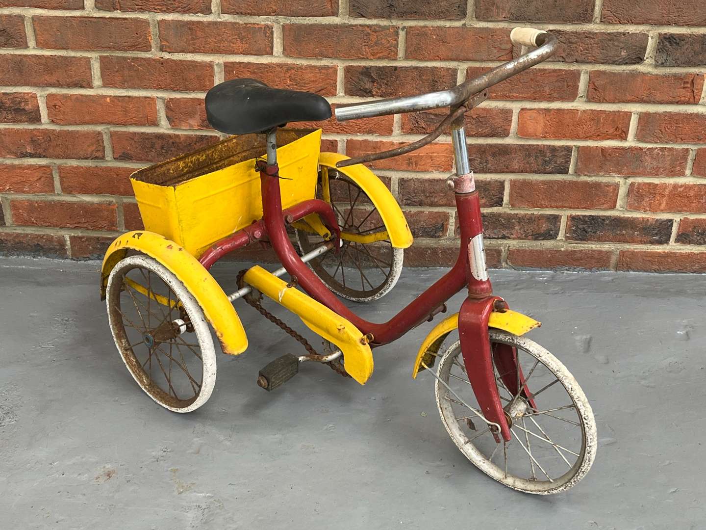 <p>Red and Yellow Tin Plate Childs Trike</p>