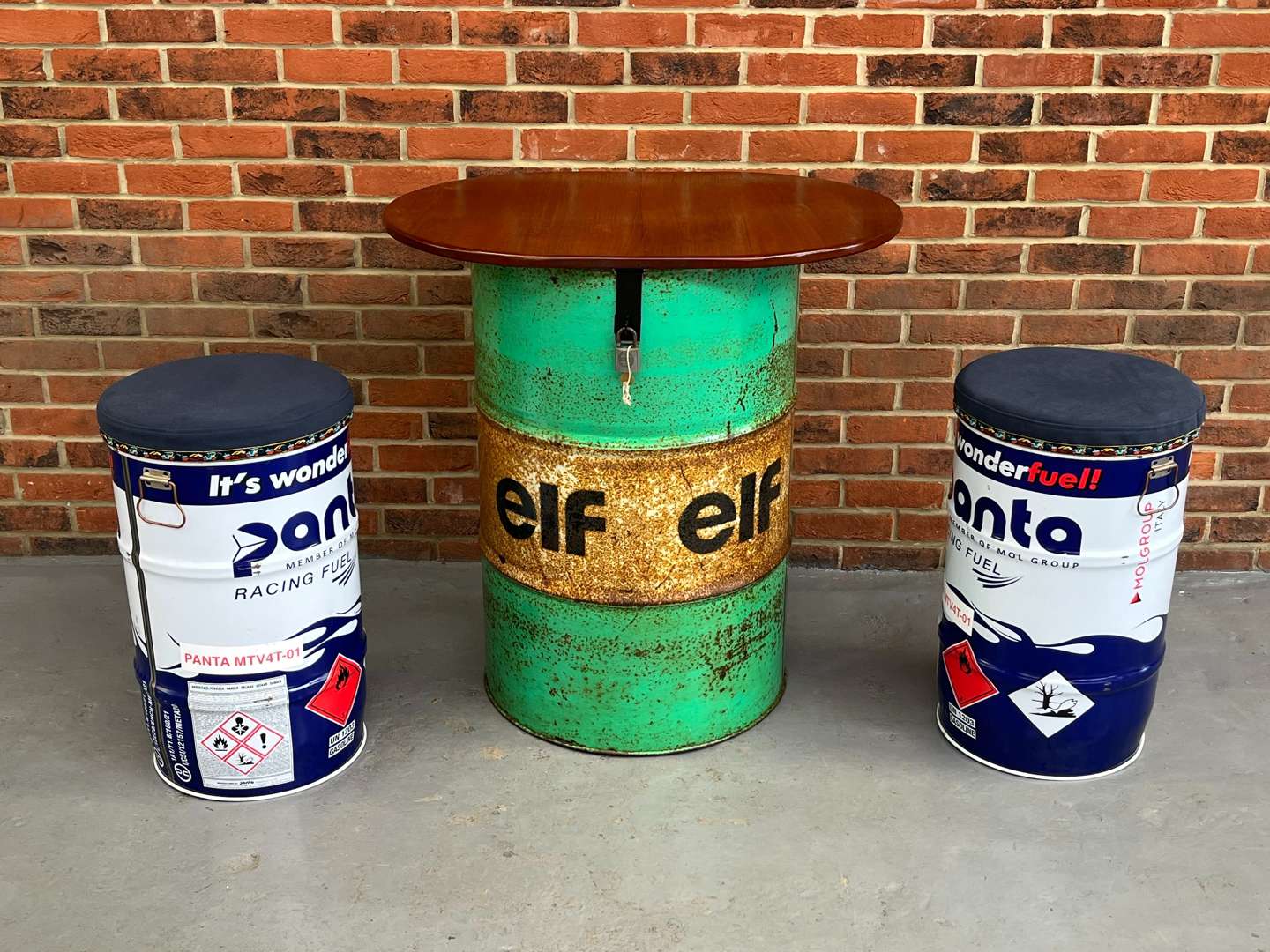 <p>ELF Oil Drum Table and Stools</p>