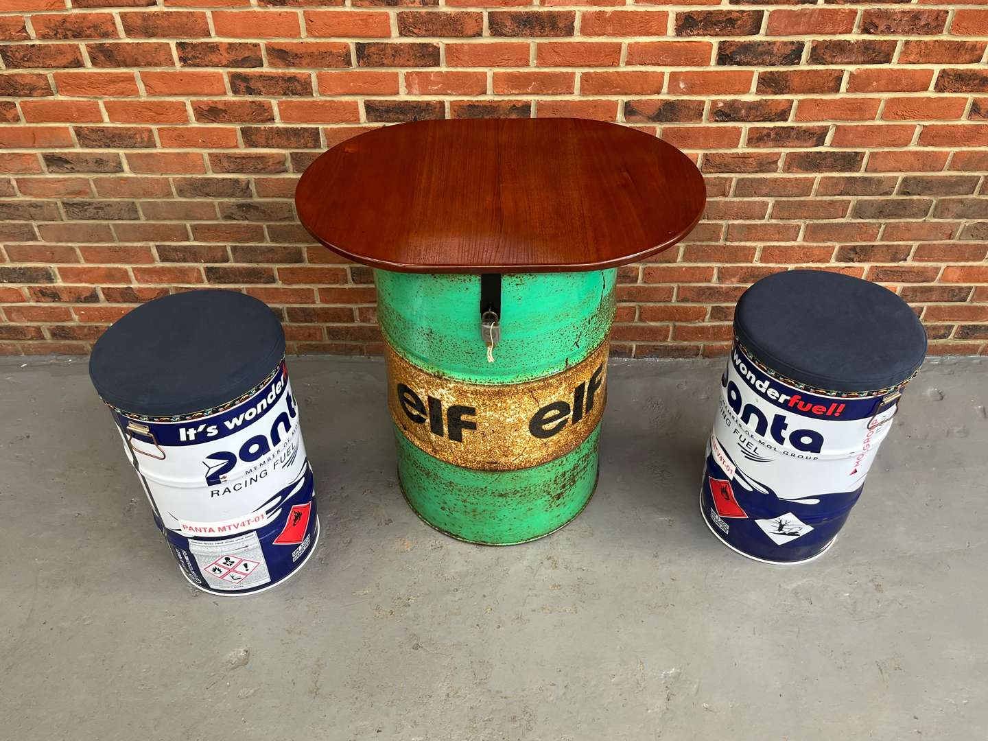 <p>ELF Oil Drum Table and Stools</p>