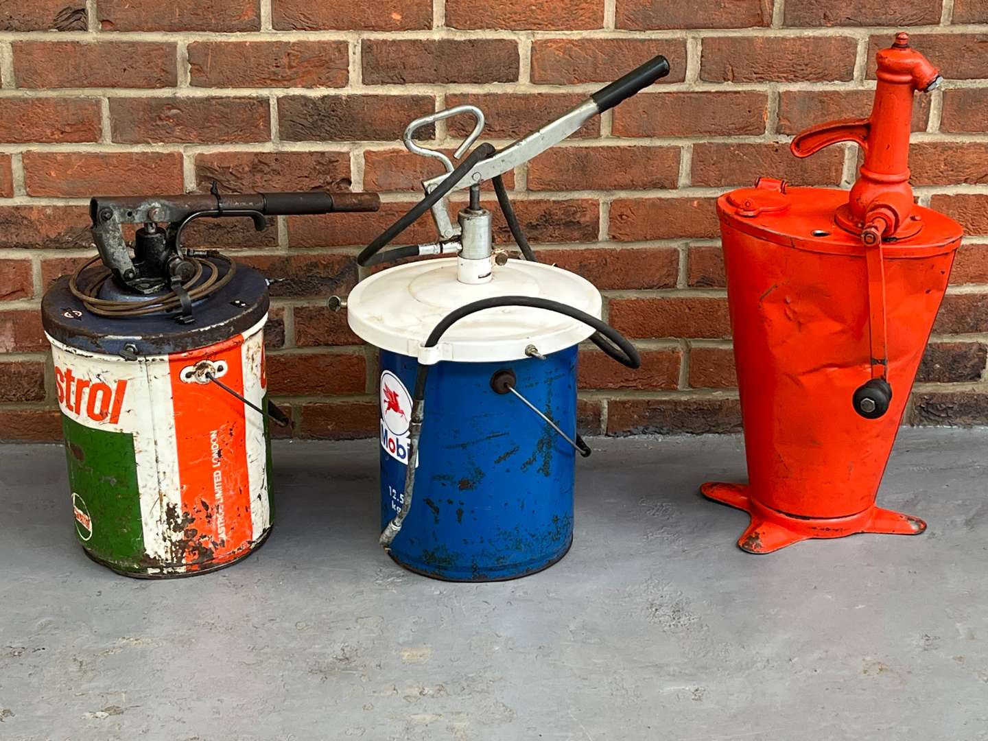 <p>Two Grease Dispensers and Oil Dispenser (3)</p>