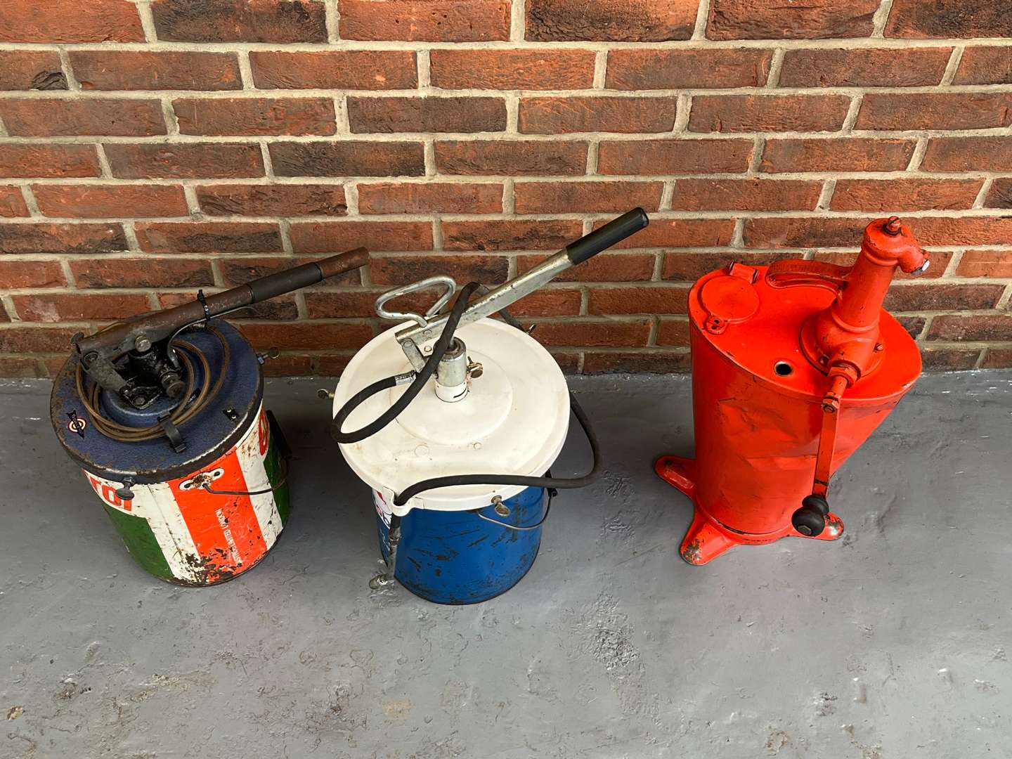<p>Two Grease Dispensers and Oil Dispenser (3)</p>