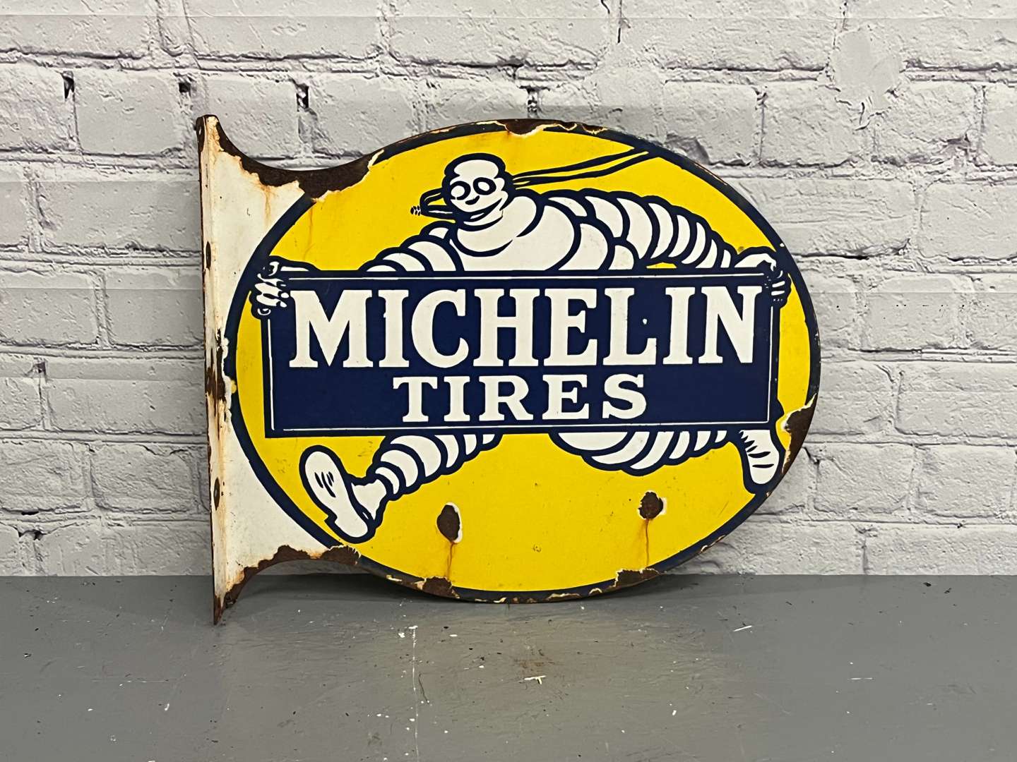 <p>Michelin Tires Enamel Flange Sign</p>