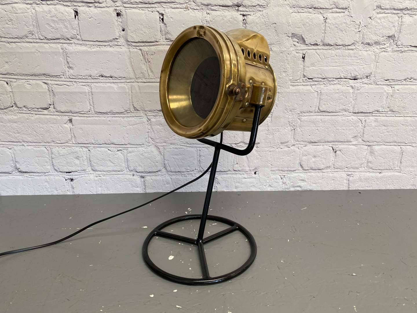 <p>An Early 20th century brass cased vehicle headlamp,</p>