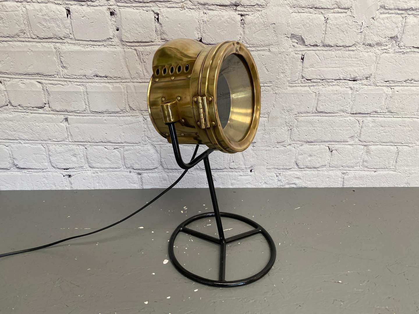 <p>An Early 20th century brass cased vehicle headlamp,</p>