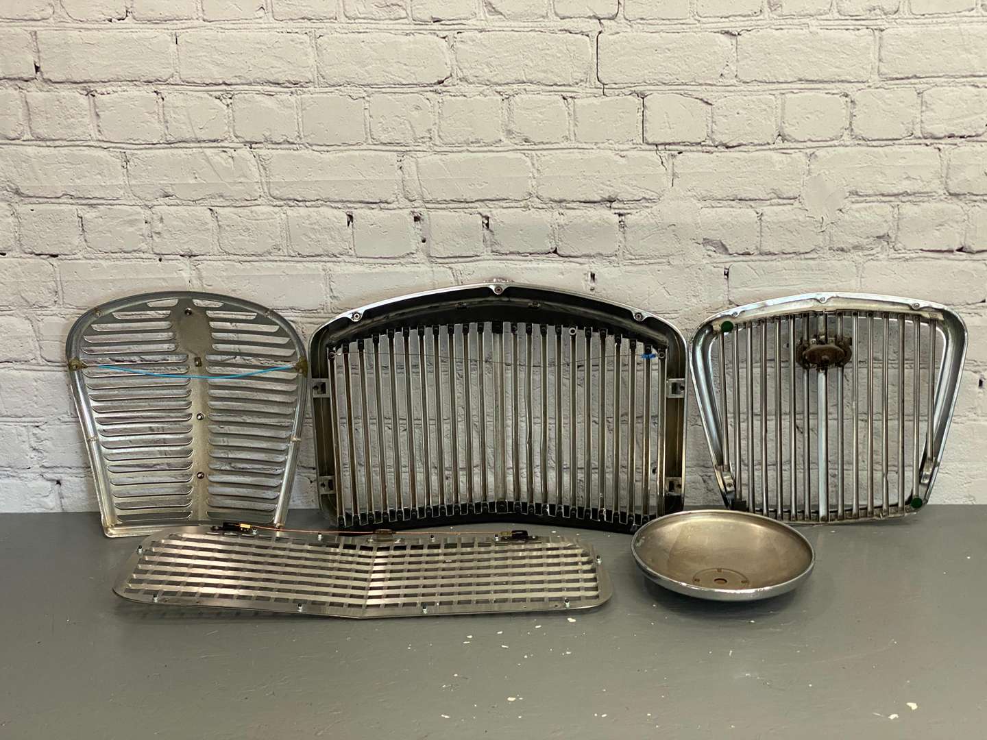 <p>A mixed lot of Four various chrome grilles,&nbsp;</p>
