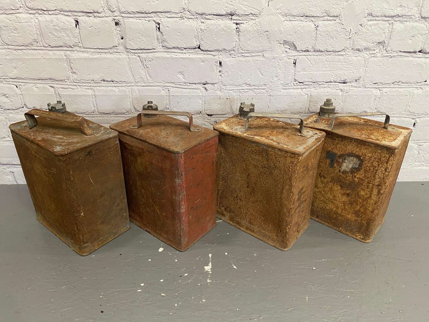 <p>Four x 2-Gallon Petrol / Oil cans,</p>