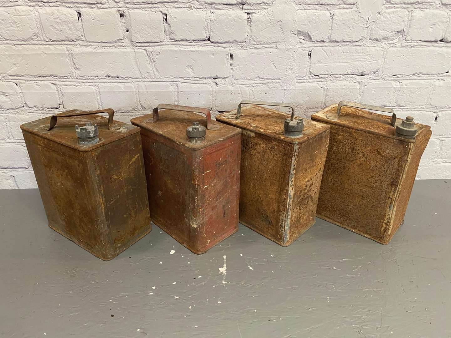 <p>Four x 2-Gallon Petrol / Oil cans,</p>