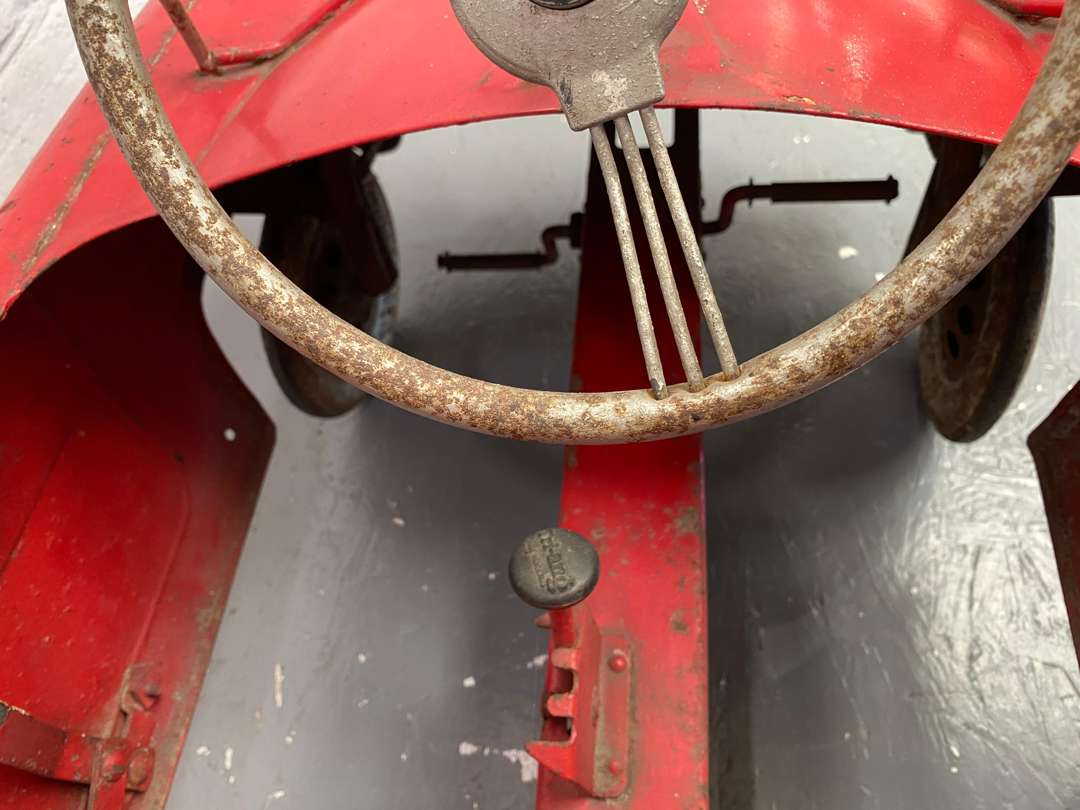 <p>Tri-ang, a mid 20th century pressed steel pedal car,</p>