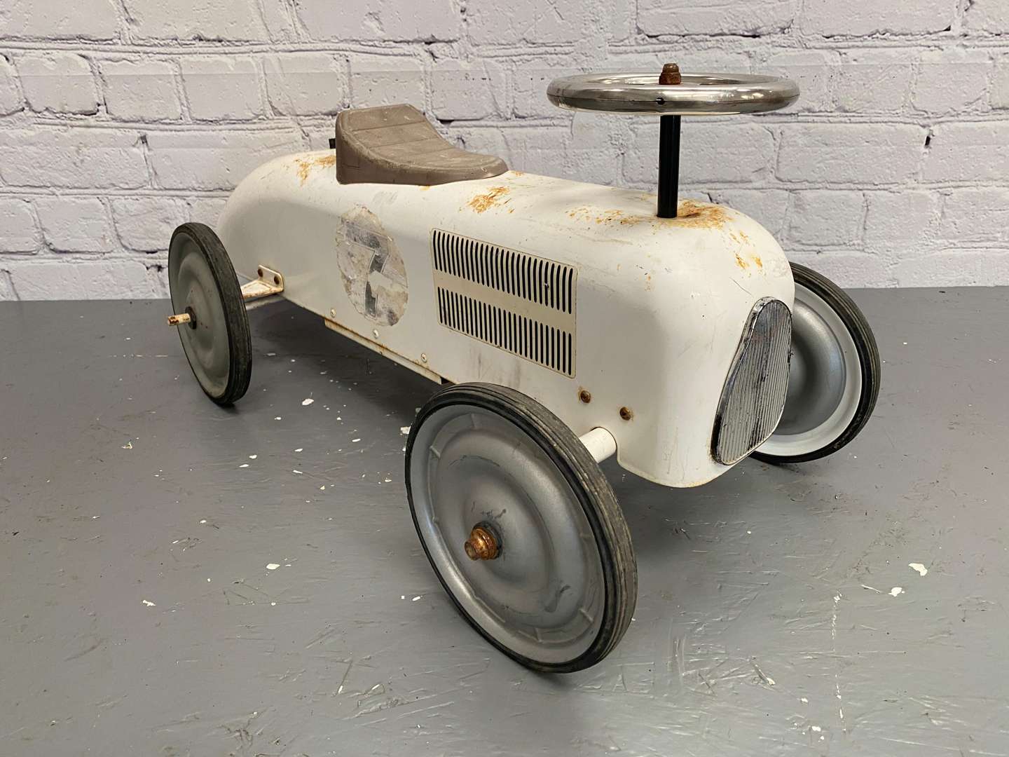 <p>Kalee for Halfords, a modern pressed and cut steel, push along car,</p>