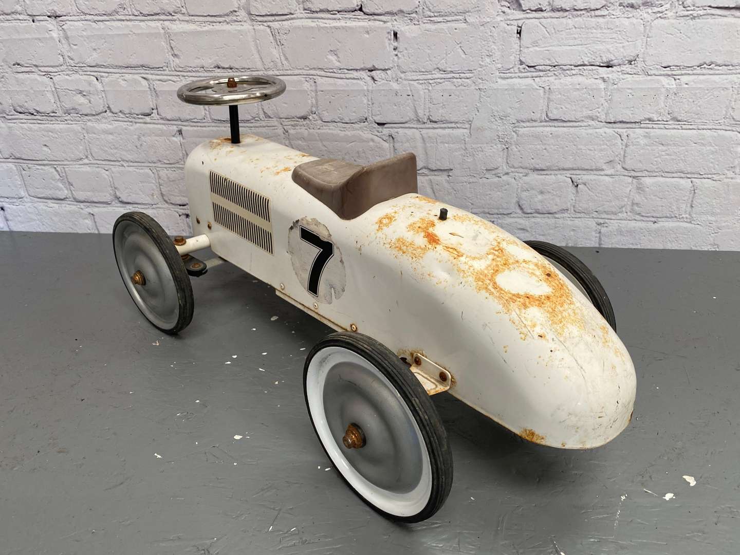 <p>Kalee for Halfords, a modern pressed and cut steel, push along car,</p>