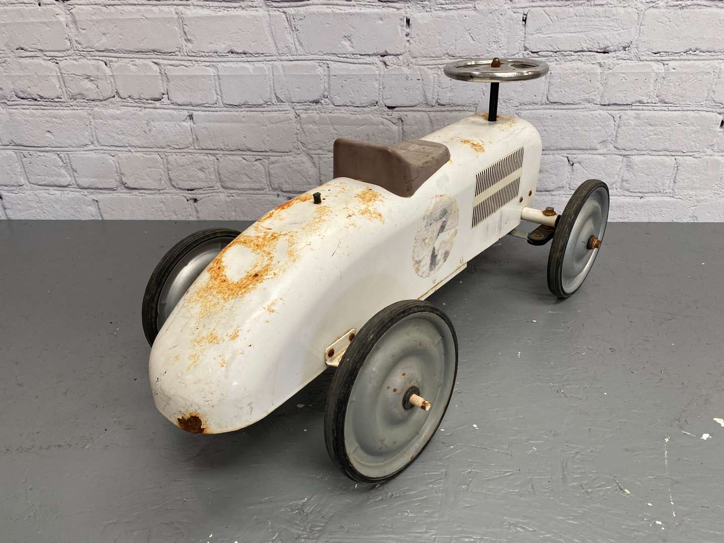 <p>Kalee for Halfords, a modern pressed and cut steel, push along car,</p>