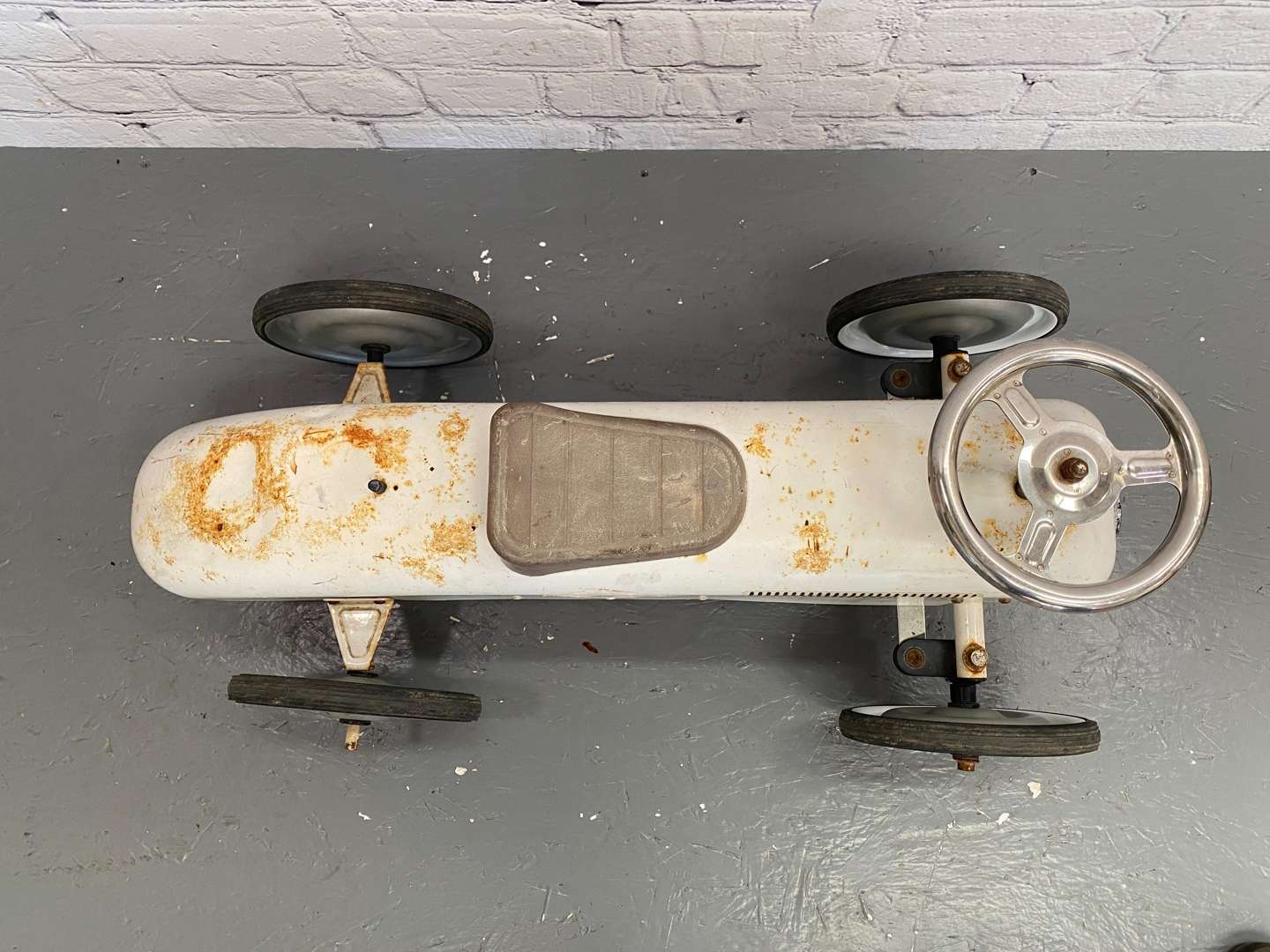 <p>Kalee for Halfords, a modern pressed and cut steel, push along car,</p>