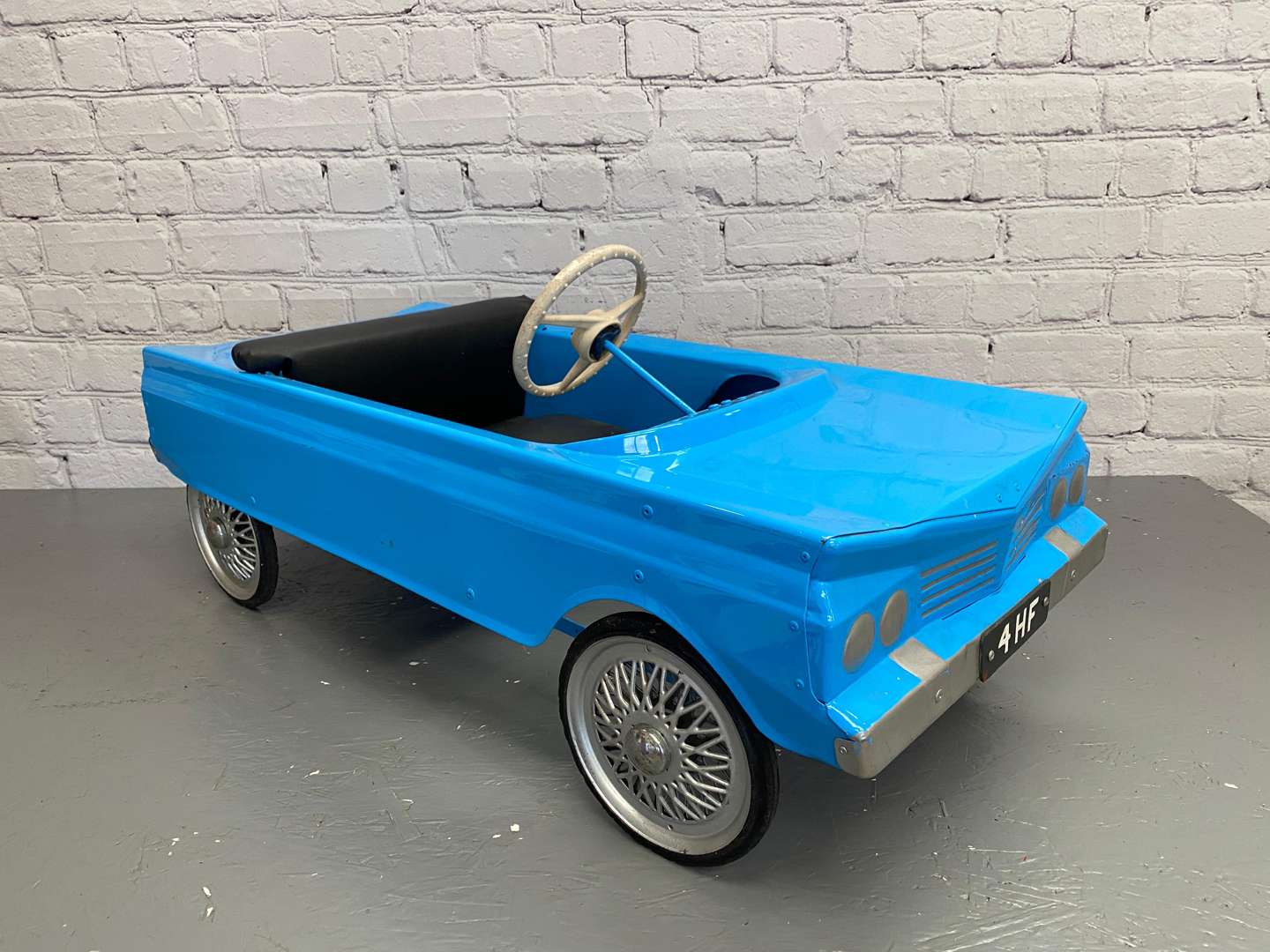 <p>Tri-ang, a 1960's pressed steel pedal car, 4HF,&nbsp;</p>
