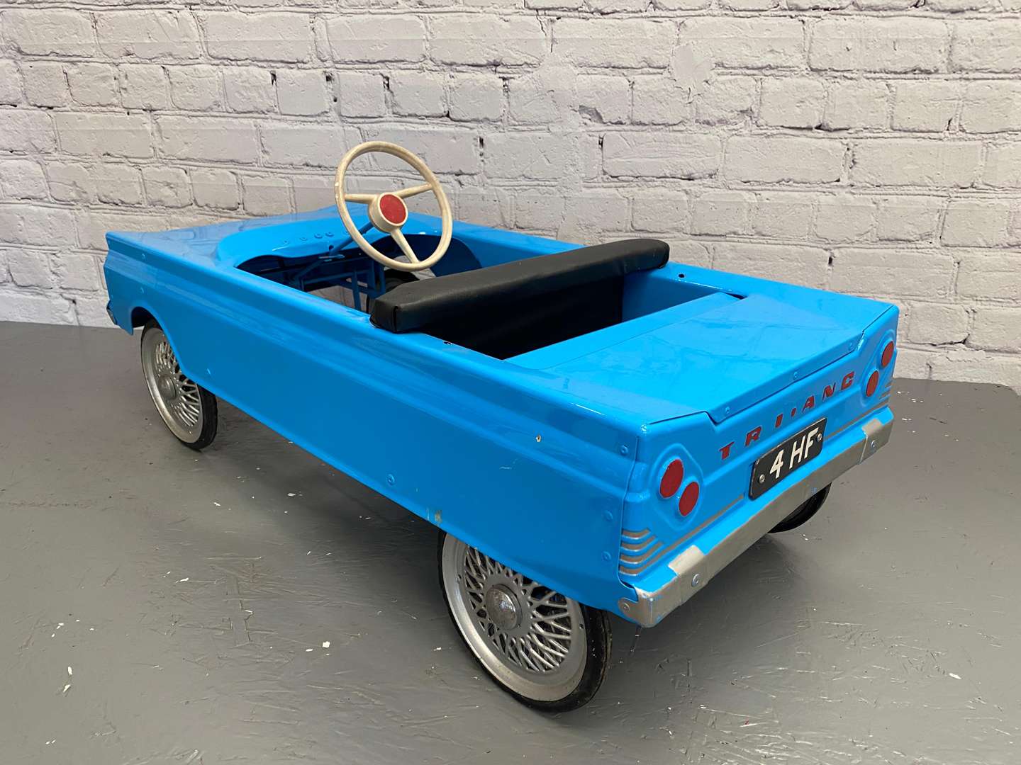 <p>Tri-ang, a 1960's pressed steel pedal car, 4HF,&nbsp;</p>