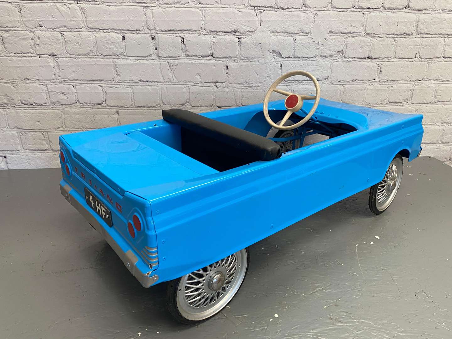 <p>Tri-ang, a 1960's pressed steel pedal car, 4HF,&nbsp;</p>