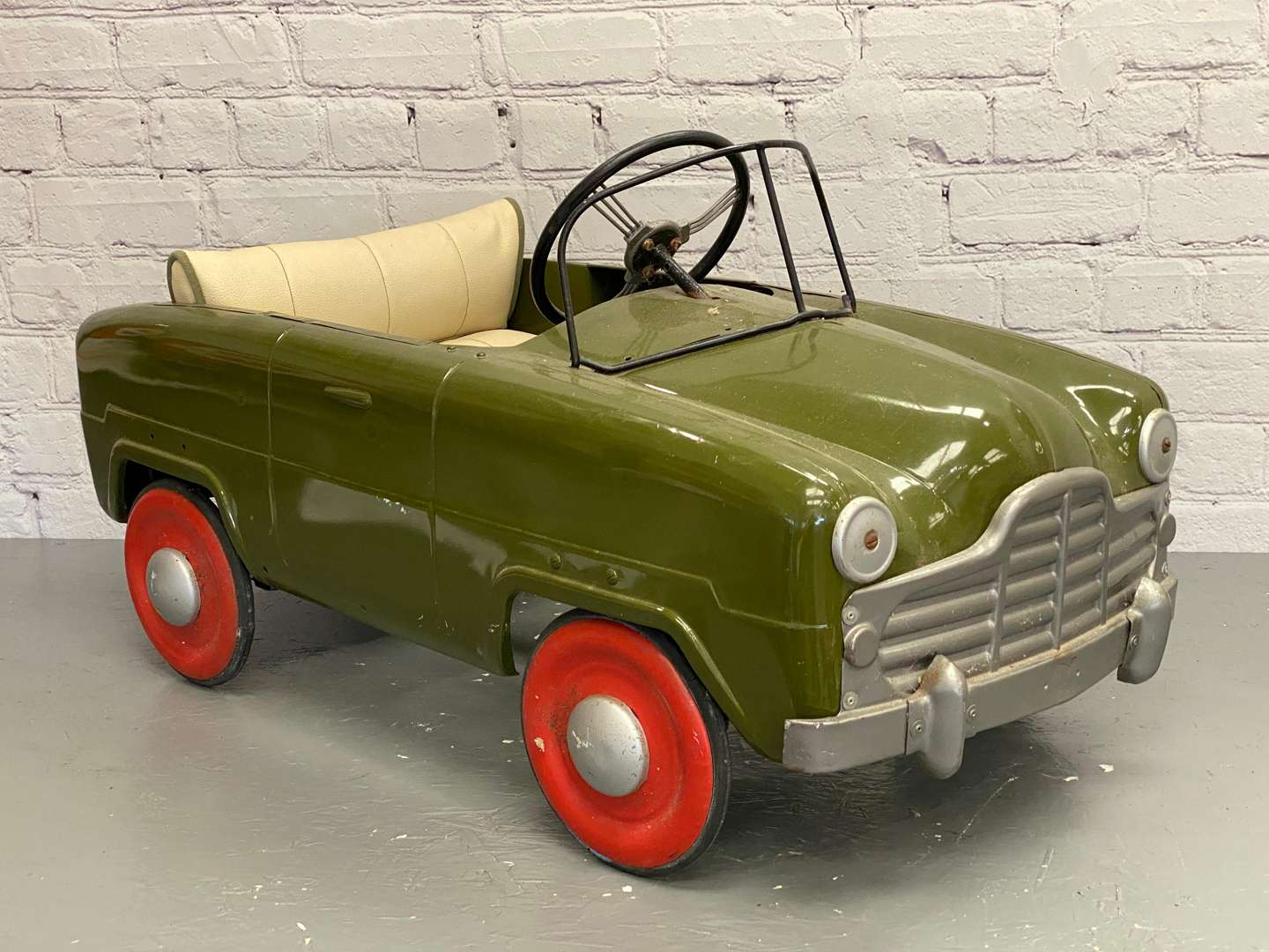<p>Tri-ang, a mid 20th century pressed steel pedal car,&nbsp;</p>