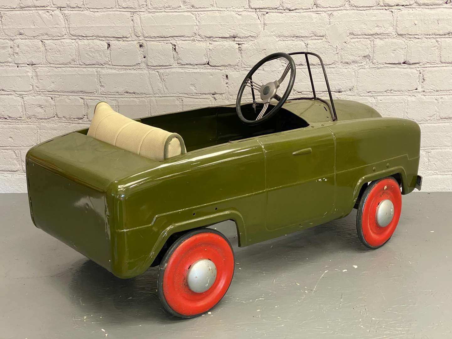 <p>Tri-ang, a mid 20th century pressed steel pedal car,&nbsp;</p>